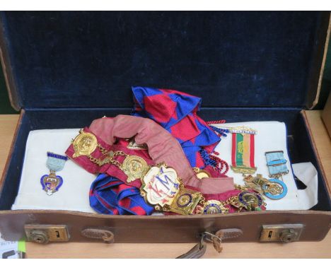 CASE CONTAINING MASONIC REGALIA INCLUDING SILVER GILT MEDALS, GILT METAL SASH, APRON ETC. 