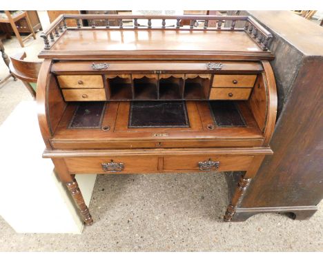 MAHOGANY FRAMED CYLINDER TAMBOUR FRONTED DESK WITH TWO DRAWERS ON RING TURNED LEGS WITH GALLERIED BACK   