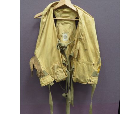RAF 1941 Pattern Yellow Mae Westyellow drill material vest.  Tan canvas light pocket to the right side.  Canvas leg ties.  In