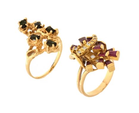 Two Vintage 14 Karat Yellow Gold Rings. One set with oval cut tsavorite garnets, the second set with rubies and diamonds. Eac