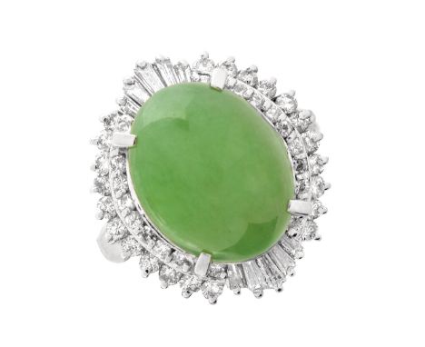 Approx. 6.55 Carat Jade Cabochon, .81 Carats TW Diamond and Platinum Ring. The diamonds of E-F color and VS1-VS2 clarity. Sta