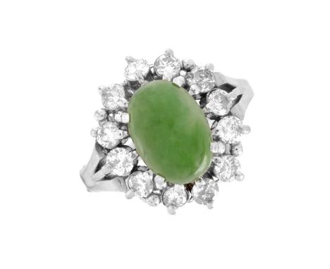 Vintage Green Jade, Approx. .70 Carats TW Round Diamond and Platinum Ring. Diamonds of E-F color and VS1-SI1 clarity. Stamped