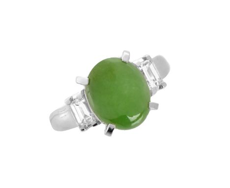 Approx. 3.71 Carat Fine Apple Green Cabochon Jade, .49 Carats TW Emerald Cut Diamond and Platinum Ring. The diamonds of D-E c