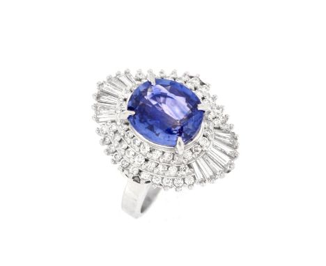 Approx. 3.70 Carat Blue Sapphire, 1.28 Carat TW Baguette and Round Brilliant Diamond, Platinum Ballerina Ring. The gem qualit