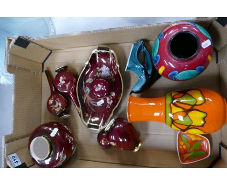 A mixed collection of ceramic items to include Carlton Rouge Royale ginger jar , vases, small urn and Poole Pottery abstract 