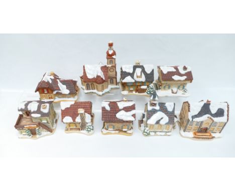 A collection of M J Hummel sculpture cottages to include Angels Duet, Winter comfort, Village bakery, All Aboard, Christmas M
