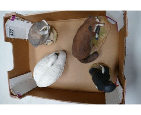 A collection of Aynsley ceramic items to include Adelie penguin, racoon, the mute swan and little owl (4)