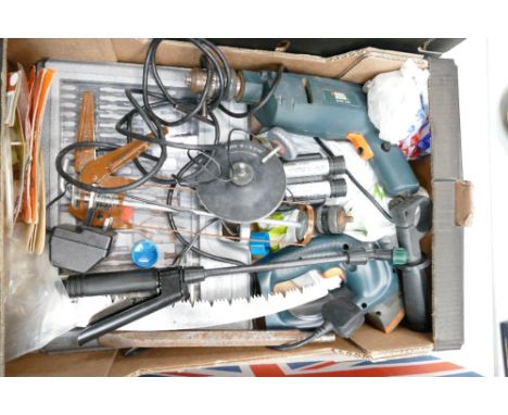 A collection of household Black & Decker work tools including drill sets, battery packs etc