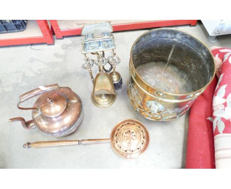 A brass embossed coal bucket with fire side tools on hanging stand, bed pan and kettle 