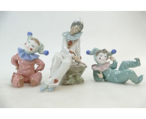 Two Nao figures of children dressed as jesters and Nao figure as boy dressed as clown(3)