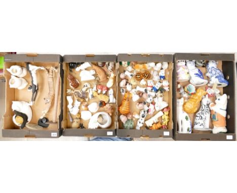 A mixed collection of ceramic, wood and resin cat figures by various manufacturers (4 trays)