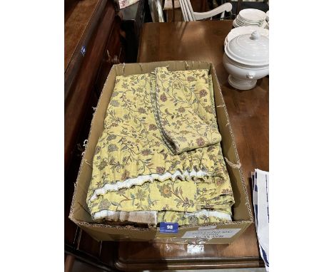 A pair of lined curtains with tiebacks
