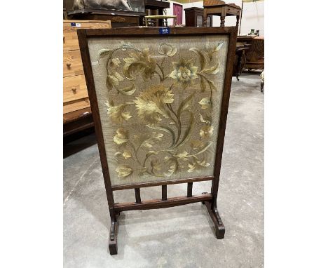 A 19th century rosewood firescreen with silk embroidered banner. 39' high