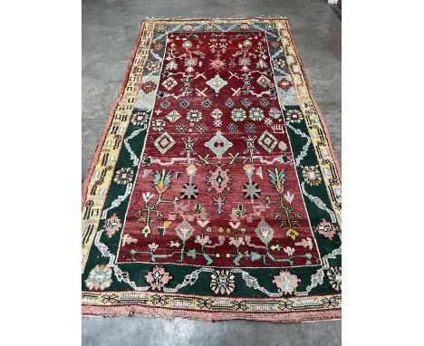 A Moroccan red ground carpet. 138' x 78'