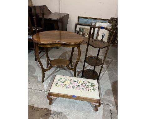 A mahogany kidney shaped two tier occasional table; a three tier oak folding cakestand and a stool with tapestry seat (3)