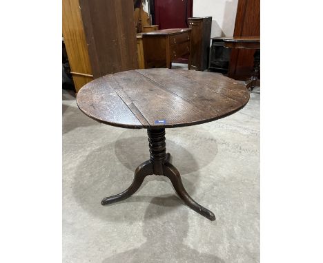 A 19th century oak snap-top tripod table. 32' diam.