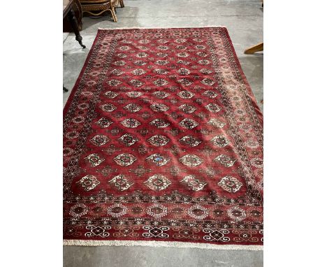 A red ground Iranian carpet. 122' x 81'