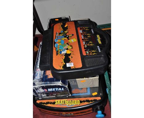 A Simpsons Skateboard modern release related pinball machine, together with a Mack Tools sound machine semi-remork tractor un