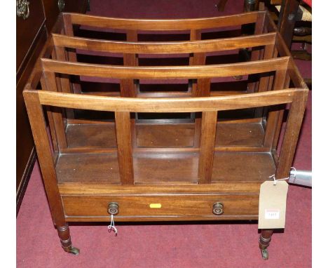 A 19th century mahogany three division Canterbury, having single lower drawer and on spindle ring turned supports, width 53cm