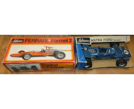 Two boxed Schuco large scale F1 race cars to include Ferrari F2, and a Matra Ford F1