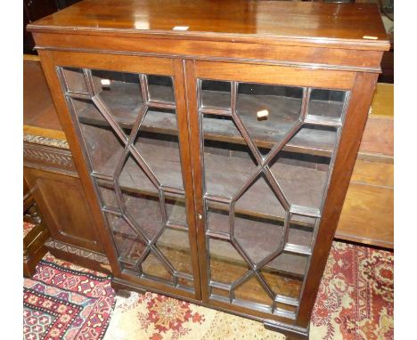 An early 20th century mahogany double door astragal glazed bookcase, on ogee bracket supports, width 86cm