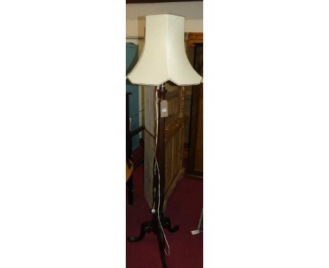 An early 20th century mahogany turned and hexagonal column standard lamp, raised on hipped supports, height (excluding fittin