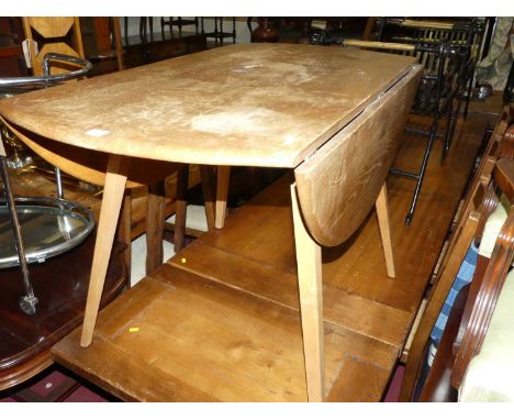 A 1960s Ercol light elm drop flap kitchen table, length 111cmCondition report: With significant fading, and watermarks to top
