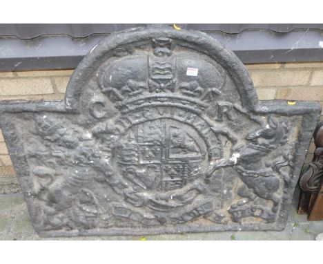 A large black painted cast iron arched fire back, with raised crested decoration, 83.5 x 103cmIn good condition overall.Some 