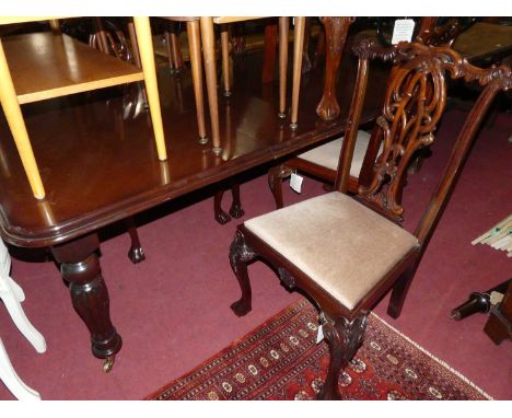 A Victorian style mahogany round cornered extending dining table, having a pull-out action, single extra drop-in leaf, raised