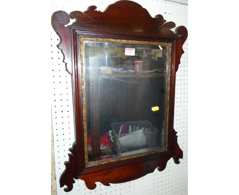A circa 1900 fret carved mahogany bevelled wall mirror, in the Chippendale taste, 64 x 46.5cm