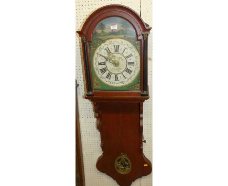 A Dutch oak drop trunk wall clock with alarm and having painted arch dial, weight driven 30 hour movement
