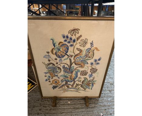 A FLORAL NEEDLEWORK FIRE SCREEN 