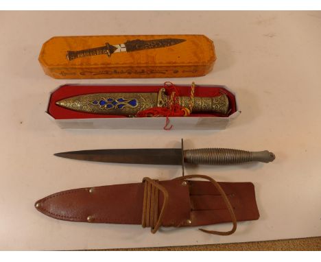 A FAIRBAIRN SYKES FIGHTING KNIFE, 17.5CM BLADE, WITH NON MILITARY LEATHER SCABBARD AND A BOXED CHINESE KNIFE (2) 