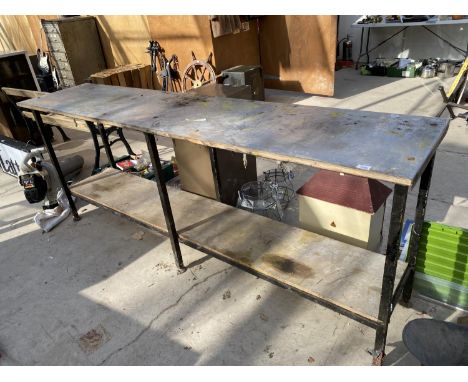A LARGE METAL WORK BENCH WITH WOODEN SHELF UNDERNEATH 