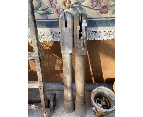 A PAIR OF VINTAGE WOODEN TENNIS NET POSTS 