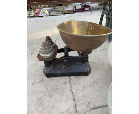 A VINTAGE SET OF SCALES WITH WEIGHTS 