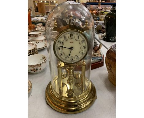 A BRASS 'KUNDO' KIENINGER &amp; OBERGFELL MANTEL CLOCK UNDER A GLASS DOME 