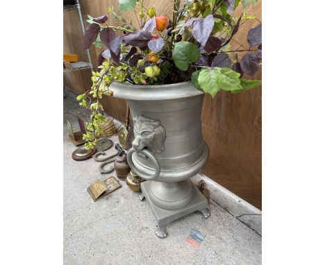 A LARGE DECORATIVE METAL URN PLANTER ON PEDESTAL BASE TO ALSO INCLUDE ARTIFICIAL FLOWERS 