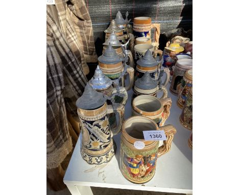 A LARGE COLLECTION OF CERAMIC LIDDED STEINS 