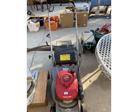 A HONDA EASY START PETROL ENGINE LAWN MOWER WITH GRASS BOX BELIEVED IN WORKING ORDER BUT NO WARRANTY 