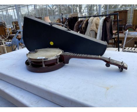 A VINTAGE BANJO WITH CARRY CASE 