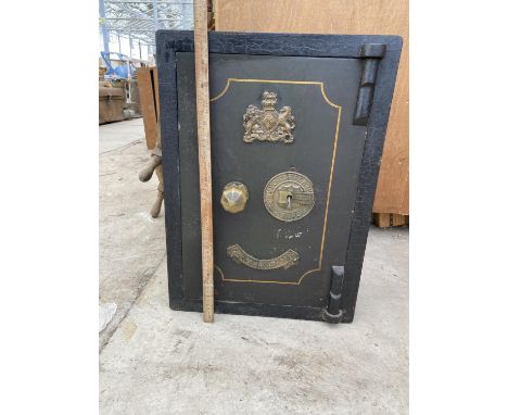 A VINTAGE FIRE RESISTING SAFE WITH KEY 