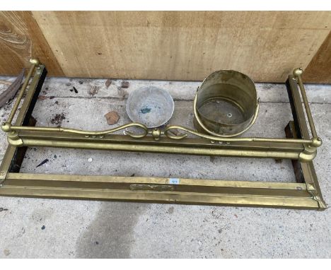 TWO BRASS FIRE FENDERS A FURTHER VINTAGE SCOOP AND A BRASS COAL BUCKET 