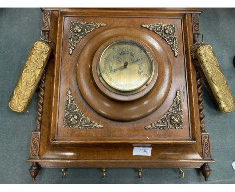 AN ORNATE VINTAGE BAROMETER TO INCLUE TWO INTEGRAL CLOTHES BRUSHES AND COAT HOOKS 