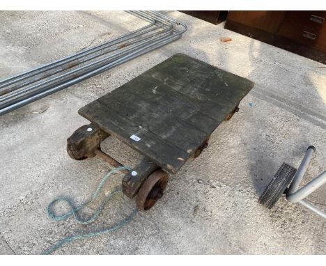 A VINTAGE WOODEN ENGINE TROLLEY 