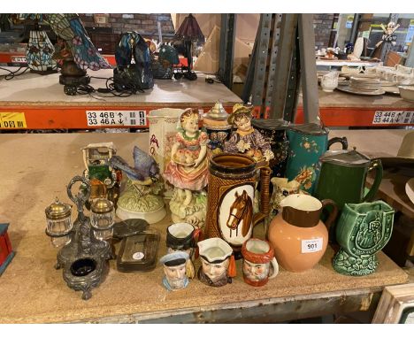 AN ASSORTMENT OF CERAMIC WARE TO INCLUDE THREE COLOURED STEINS, CHARACTER JUGS ETC 