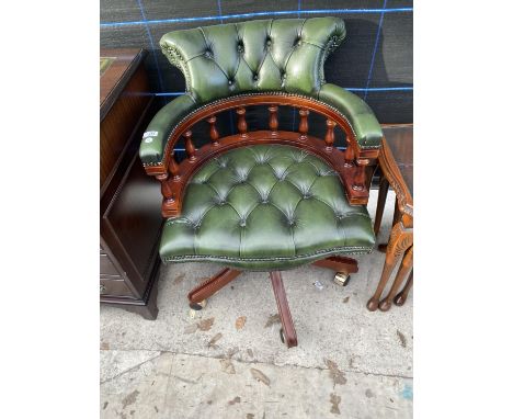 A 19TH CENTURY STYLE REVOLVING BUTTON-BACK OFFICE TUB CHAIR WITH TURNED UPRIGHTS 