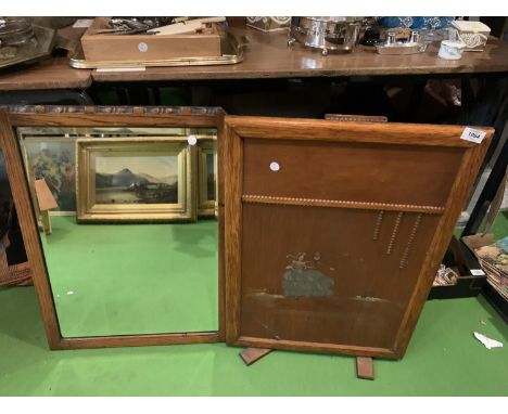 AN OAK FRAMED BEVEL EDGE MIRROR AND A FIRE SCREEN 