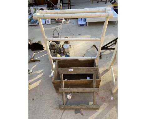 A VINTAGE TOWEL RAIL AND A BEER CRATE 