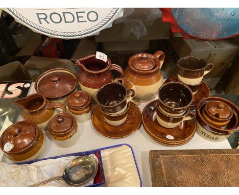 A LARGE ASSORTMENT OF STONE WARE ITEMS TO INCLUDE A TEAPOT, A MILK JUG ETC 